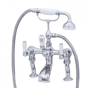 Bath/shower mixer on pillar unions with levers and a handshower in a cradle