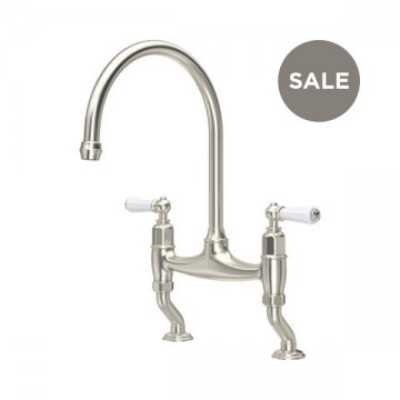 Ionian 2 hole bench mounted sink mixer with offset legs & white porcelain lever taps