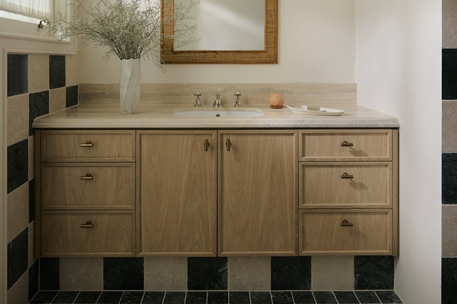 A timber vanity with Armac Martin brass t-bar handles and traditional hot and cold nickel taps from Perrin & Rowe. 
