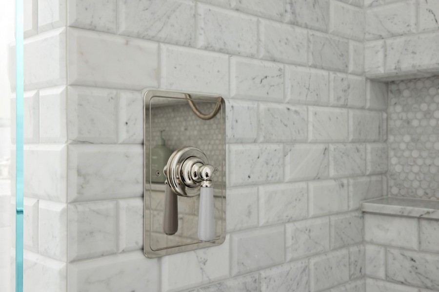 Guest ensuites featuring polished nickel tapware with Rockwell finishes, including Seattle Grey and Willow Green, creating cohesive yet distinctive bathroom designs.