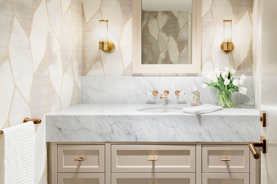 Glamorous bathroom features traditional brass bathroom taps, brass towel rail and brass t-bar drawer handles.