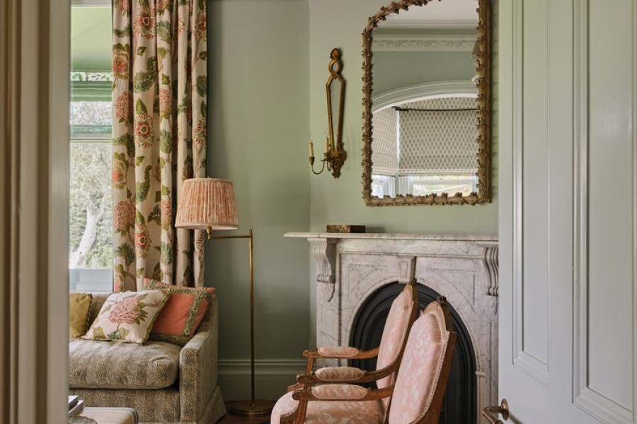 Delicate floral prints are layered with Joseph Giles brass lever handles