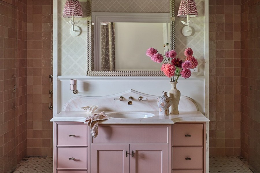 Master ensuite with pink cabinetry, Perrin & Rowe tapware with white porcelain lever handles, and soft, elegant styling with pink Rockwell accessories. 
