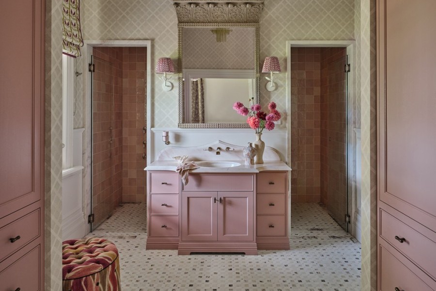 Master ensuite with pink cabinetry, Perrin & Rowe tapware with white porcelain lever handles, and soft, elegant styling with pink Rockwell accessories. 
