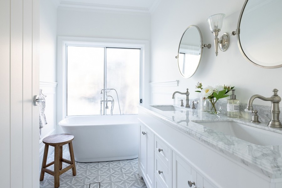 White freestanding bath with brushed nickel country style taps and double vanity