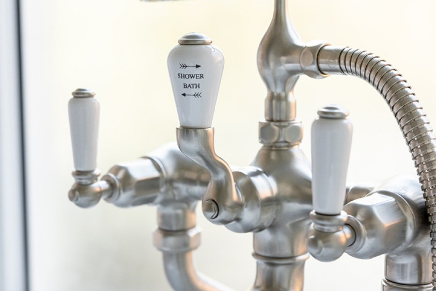Brushed nickel freestanding traditional bath taps on legs