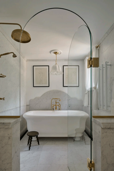 Main bathroom with Perrin & Rowe floor-standing bath mixer, matching shower with 200mm rose, and Paris freestanding bath by The Water Monopoly, creating a serene and luxurious space.
