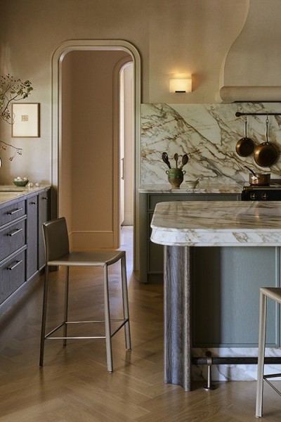 A kitchen with marble bench and Perrin & Rowe tapware. 