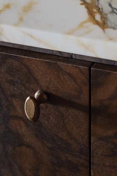 Solid bronze cabinet pulls display the signs of traditional casting methods on stunning walnut drinks cabinet.
