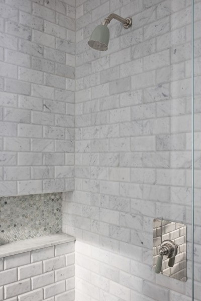 Guest ensuites featuring polished nickel tapware with Rockwell finishes, including Seattle Grey and Willow Green, creating cohesive yet distinctive bathroom designs.