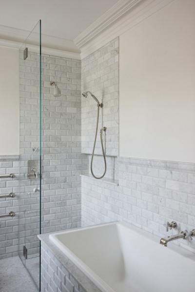 Guest ensuites featuring polished nickel tapware with Rockwell finishes, including Seattle Grey and Willow Green, creating cohesive yet distinctive bathroom designs.