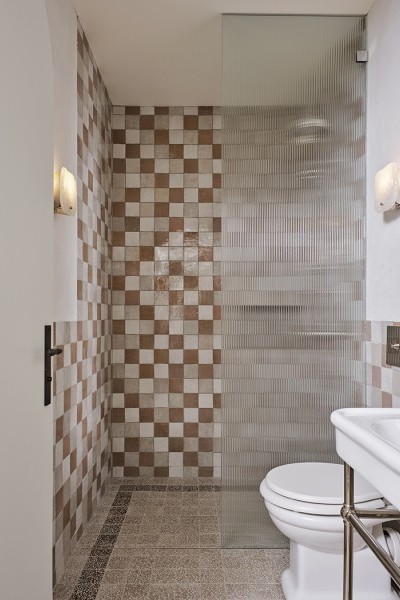 Solid brass shower set in polished nickel plate from Britain with crosshead taps over terracotta look checkerboard tiles