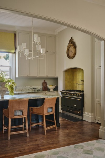 Heritage-style kitchen in Warrnambool with marble benchtops, Perrin & Rowe tapware, handcrafted joinery, and citrus-accented walls and tiles.