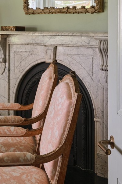 Delicate floral prints are layered with Joseph Giles brass lever handles