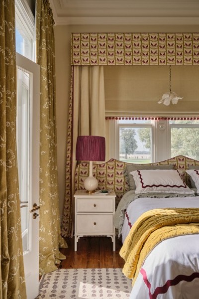 Master bedroom with yellow and pink accents that tie into master ensuite and with citrus kitchen feature the Darlington door levers by Joseph Giles