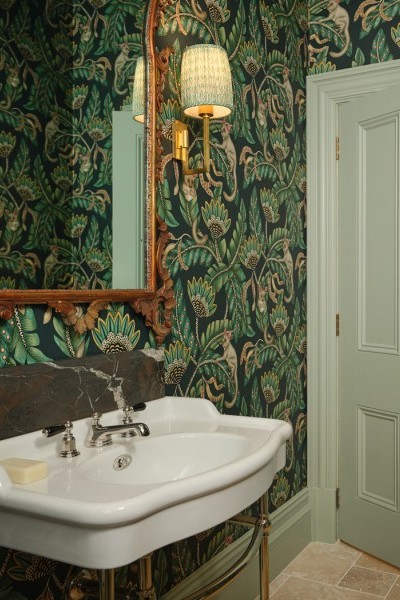 Green accents and feature wallpaper set against the soft white porcelain of the Paris basin with Hawthorn Hill basin stand