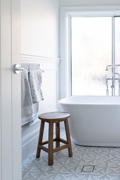 White freestanding traditional bath with brushed nickel country style bath taps