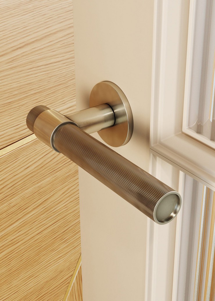 Doors dressed with beautiful door lever handles with striped lines and smooth detailing from Joseph Giles. 