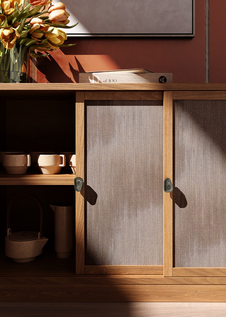 Natural cast bronze handles add detail to beautiful hand-crafted wooden cabinet housing an organic pottery display.