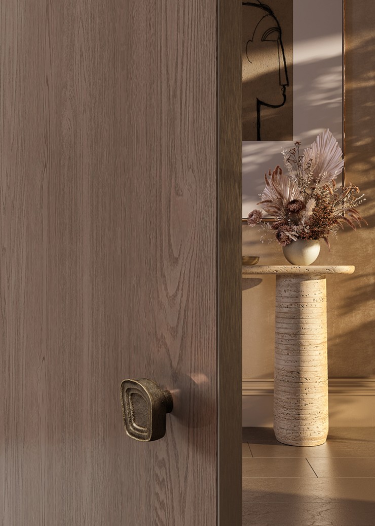 Organic shaped door knob in hand-cast brass modelled on a rock pool formation opens the door to a stone pillared console.