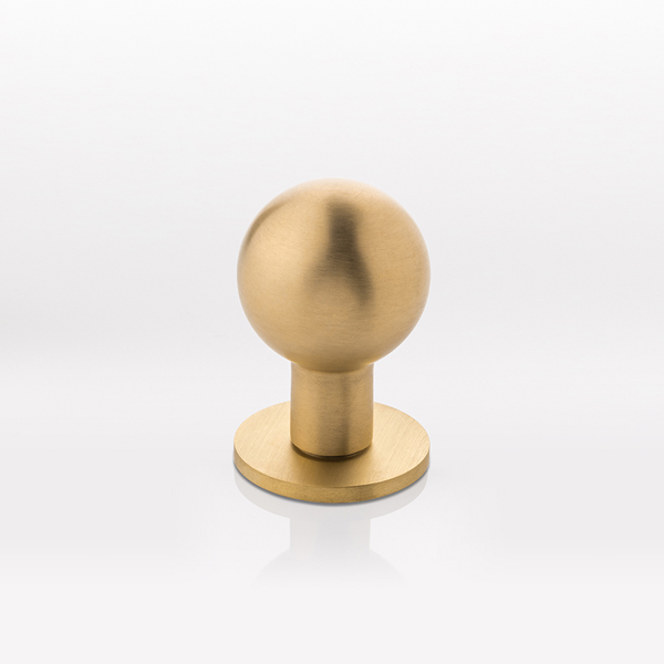 Norman solid brass door knob with round rose