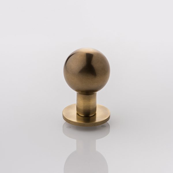 Norman solid brass door knob with round rose