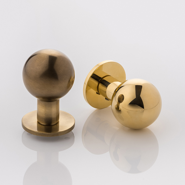 Norman solid brass door knob with round rose