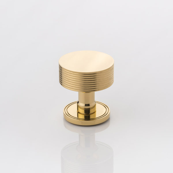 Arnett II solid brass door knob with grooved rose