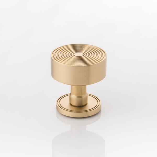 Fowler II solid brass door knob with grooved rose