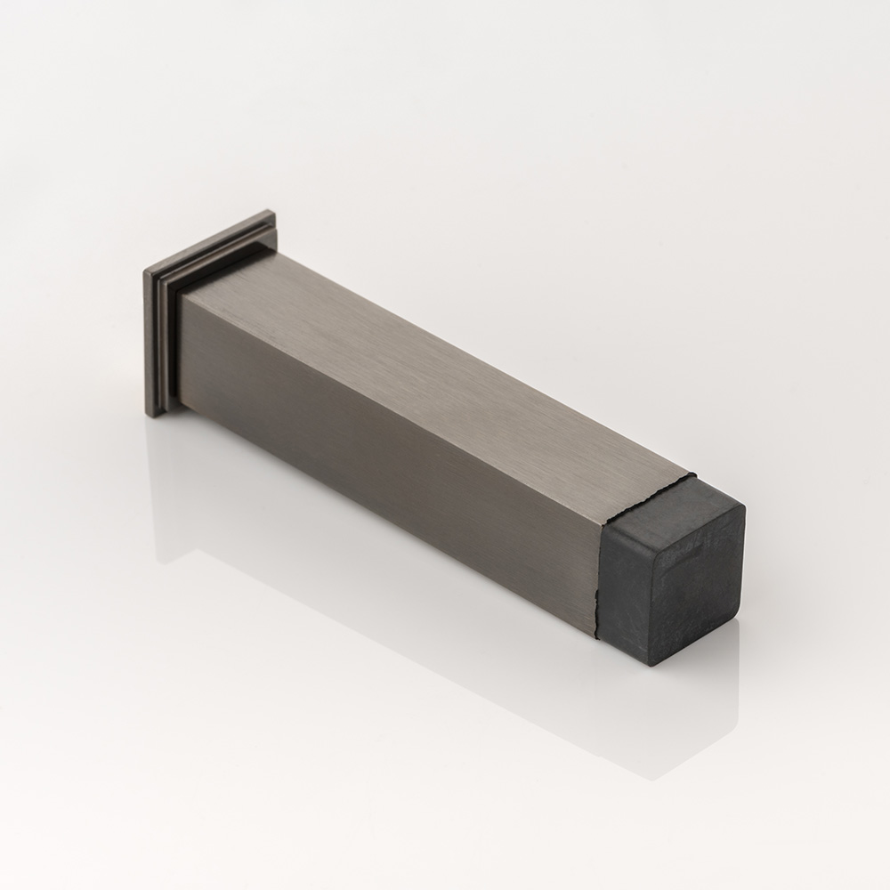 Cube solid brass wall-mounted door stopper with decorative stepped plate 