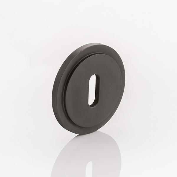 Solid brass keyhole profile round stepped escutcheon