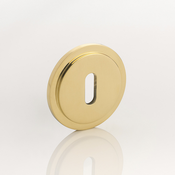 Solid brass keyhole profile round stepped escutcheon