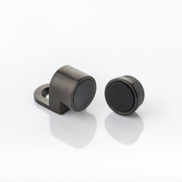 Magnetic cabinet catch with leather pad