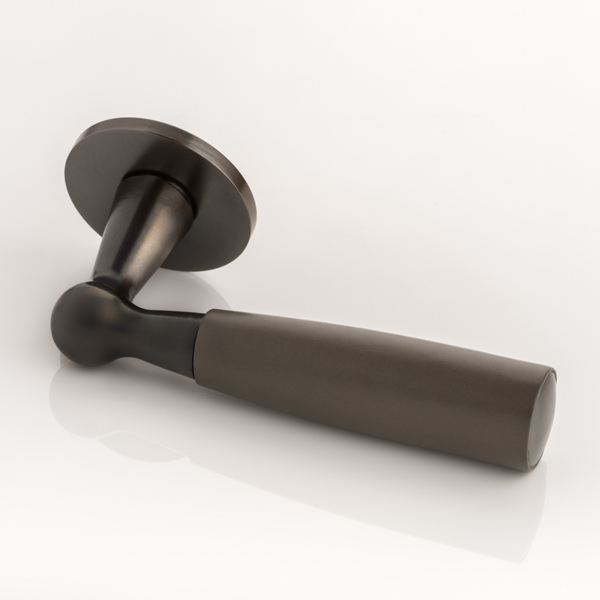 Bennett solid brass door lever handle with hand stitched leather & round rose