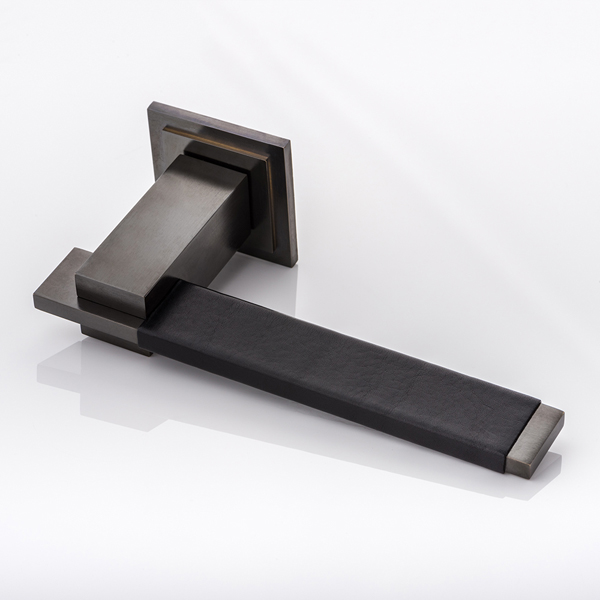 Holmes II solid brass door lever handle with hand stitched leather & square stepped rose