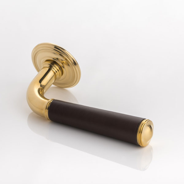 Darlington II solid brass door lever handle with hand stitched leather & ornate rose