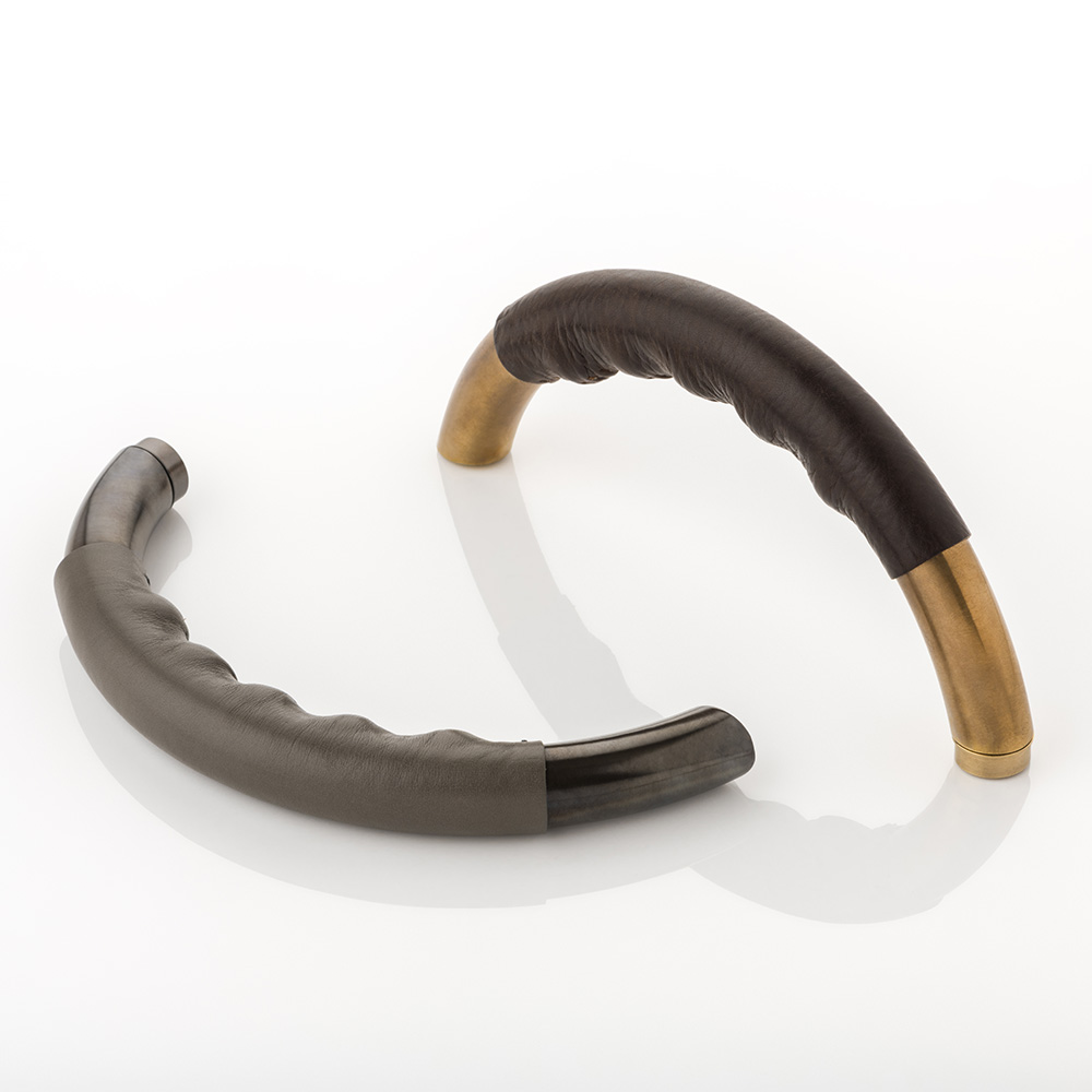 Infinity solid brass door lever handle with hand stitched leather & roseless rose