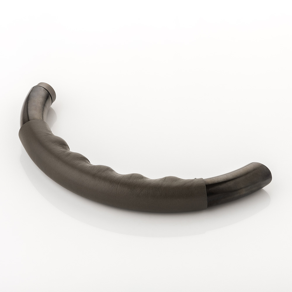 Infinity solid brass door lever handle with hand stitched leather & roseless rose