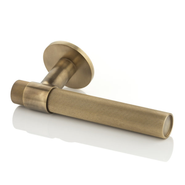 Montgomery solid brass door lever handle with linear knurl & round rose