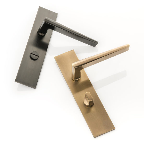 Wedge door lever handle with backplate and privacy turn/release