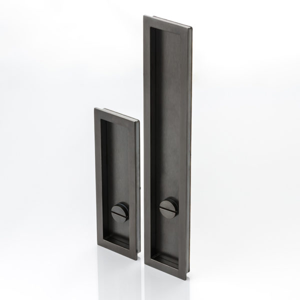 Rectangular solid brass recessed pull with privacy turn/release