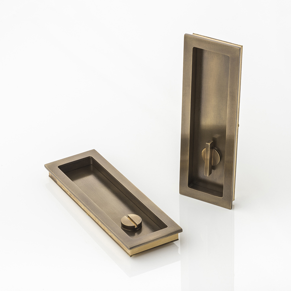Rectangular solid brass recessed pull with privacy turn/release