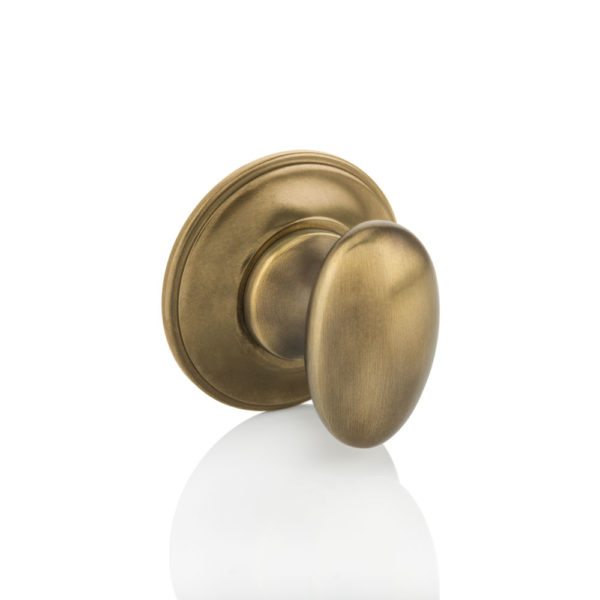 Oval thumb turn with traditional rose